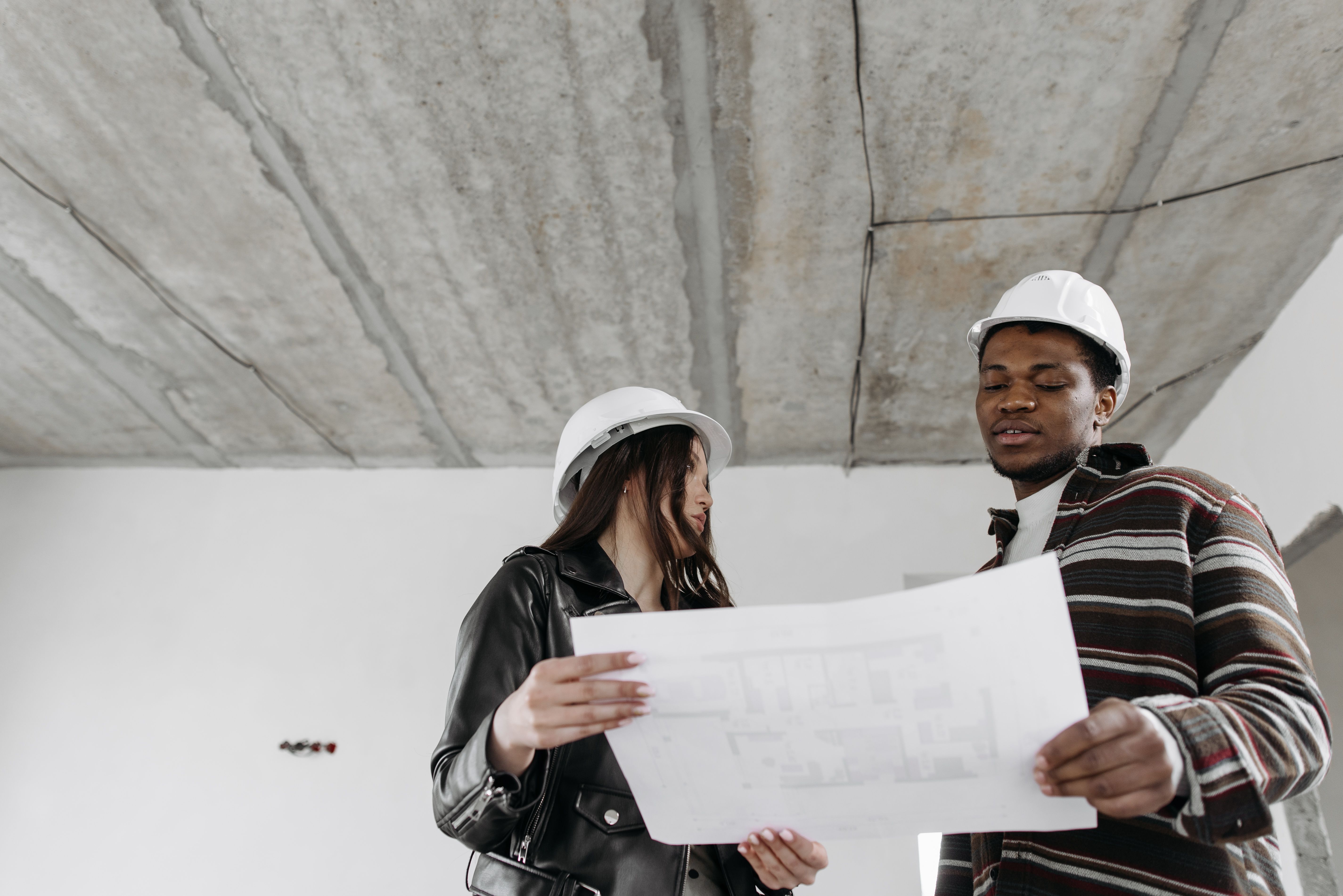 Construction team reviewing job filing requirements